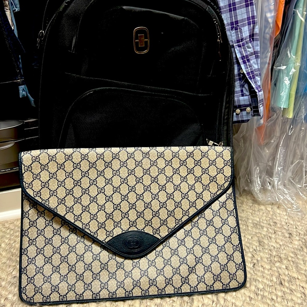 Gucci: Large clutch, billfold, laptop holder, travel organizer, etc
